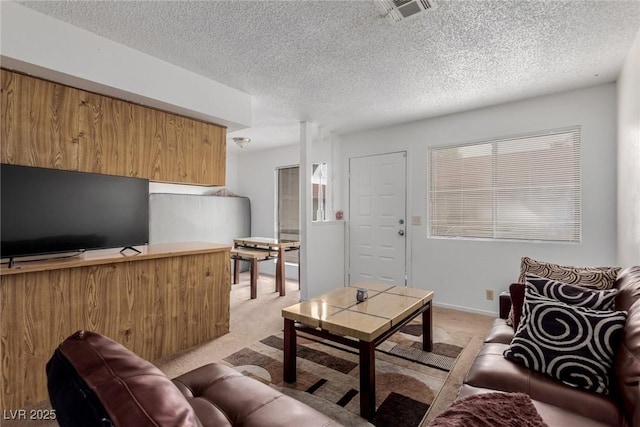 4300 N Lamont St Unit 209, Las Vegas, NV 89115 - living area featuring light carpet and a textured ceiling