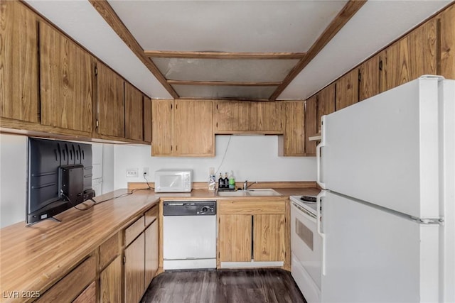 4300 N Lamont St Unit 209, Las Vegas, NV 89115 - kitchen with white appliances, dark wood-style floors, light countertops, and brown cabinets