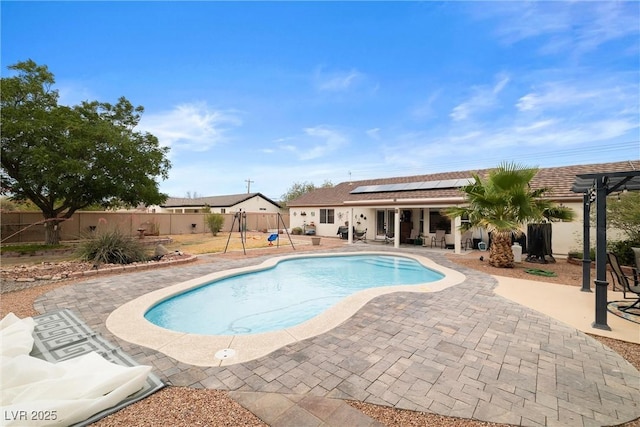 180 W Wilson Rd, Pahrump, NV 89048 - view of swimming pool featuring a patio area and a fenced backyard