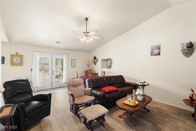 180 W Wilson Rd, Pahrump, NV 89048 - living room with lofted ceiling, light wood-style floors, ceiling fan, and french doors