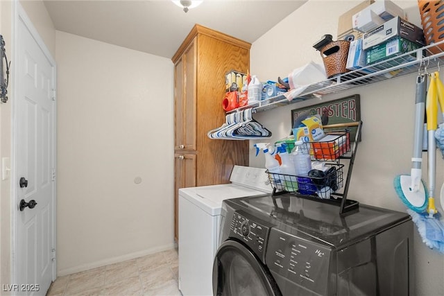 180 W Wilson Rd, Pahrump, NV 89048 - laundry room featuring washing machine and dryer and cabinet space