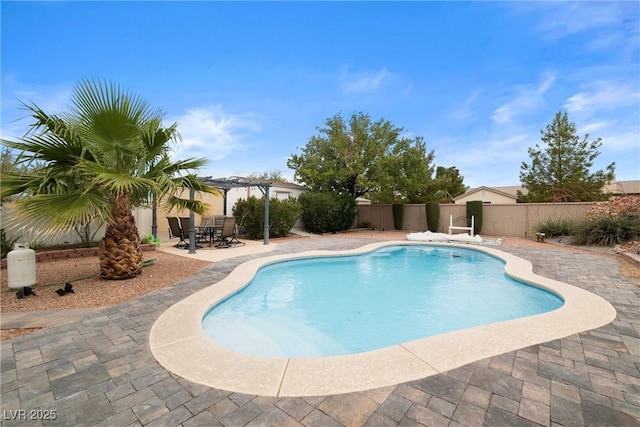 180 W Wilson Rd, Pahrump, NV 89048 - view of pool featuring a pergola, a fenced backyard, a patio area, and outdoor dining area