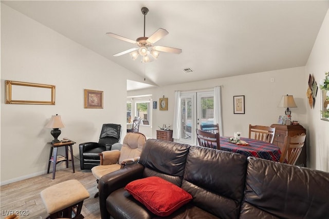 180 W Wilson Rd, Pahrump, NV 89048 - living room with wood finished floors, vaulted ceiling, ceiling fan, and french doors