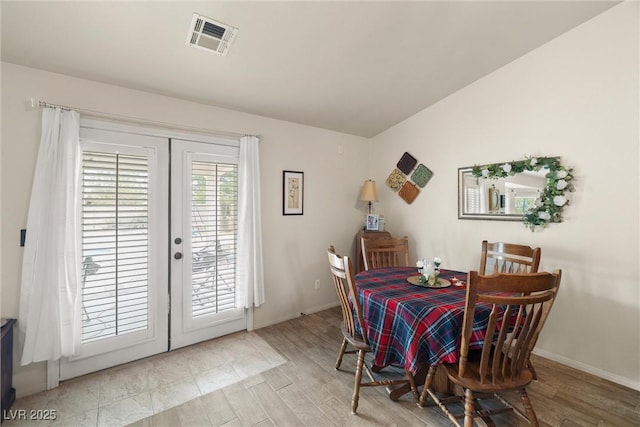180 W Wilson Rd, Pahrump, NV 89048 - dining room featuring french doors and wood finished floors