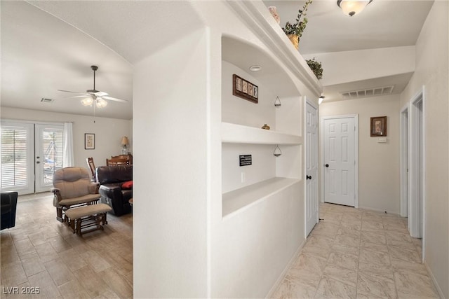 180 W Wilson Rd, Pahrump, NV 89048 - hallway featuring baseboards and built in shelves