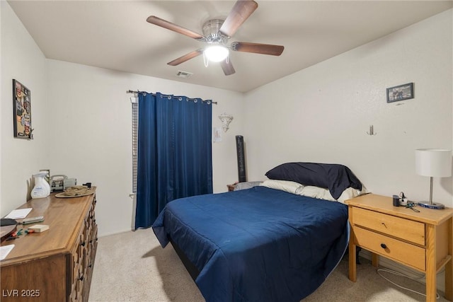 180 W Wilson Rd, Pahrump, NV 89048 - bedroom featuring light colored carpet and a ceiling fan
