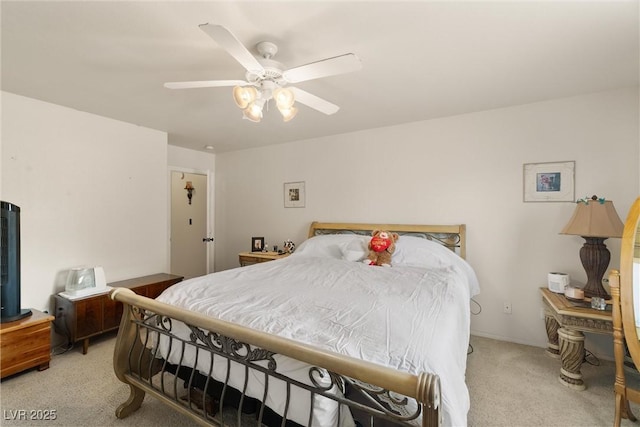 180 W Wilson Rd, Pahrump, NV 89048 - bedroom featuring light carpet and a ceiling fan