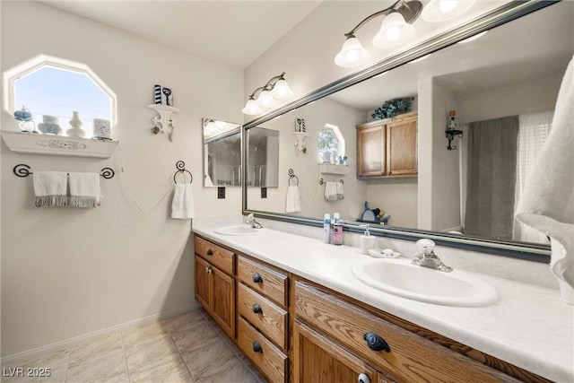 180 W Wilson Rd, Pahrump, NV 89048 - bathroom with double vanity and baseboards