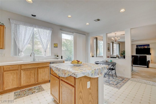 7427 Wagonwheel Ranch Way, Las Vegas, NV 89113 - kitchen featuring light flooring, a chandelier, light countertops, recessed lighting, and a kitchen island