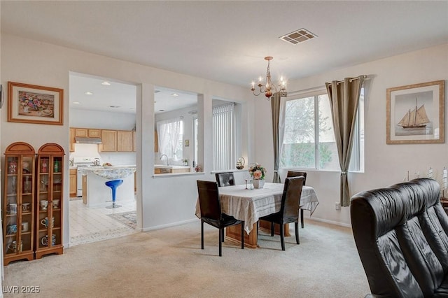 7427 Wagonwheel Ranch Way, Las Vegas, NV 89113 - dining space with a chandelier and light carpet