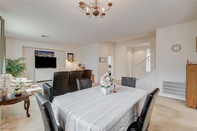 7427 Wagonwheel Ranch Way, Las Vegas, NV 89113 - dining area featuring light carpet, stairs, and a chandelier