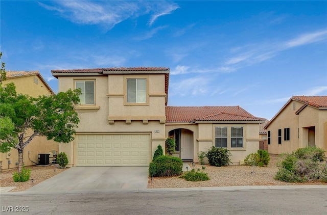 7427 Wagonwheel Ranch Way, Las Vegas, NV 89113 - mediterranean / spanish house with a tiled roof, concrete driveway, stucco siding, and a garage