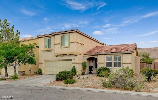 7427 Wagonwheel Ranch Way, Las Vegas, NV 89113 - mediterranean / spanish-style home with stucco siding, concrete driveway, a tile roof, and a garage