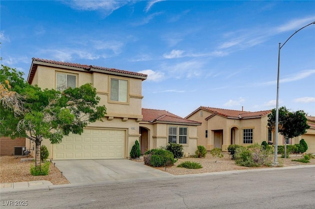 7427 Wagonwheel Ranch Way, Las Vegas, NV 89113 - mediterranean / spanish-style house featuring driveway, a garage, stucco siding, and a tile roof