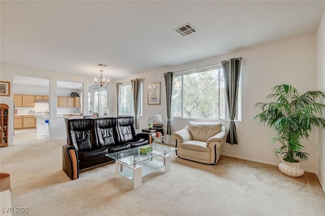 7427 Wagonwheel Ranch Way, Las Vegas, NV 89113 - living area featuring a chandelier and light colored carpet