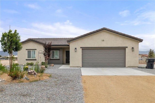 2120 Upland Ave, Pahrump, NV 89048 - single story home with driveway, stucco siding, and an attached garage