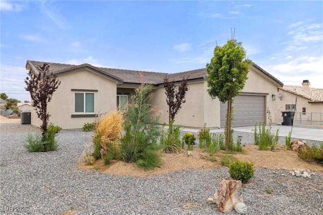 2120 Upland Ave, Pahrump, NV 89048 - ranch-style house with a garage, stucco siding, and concrete driveway