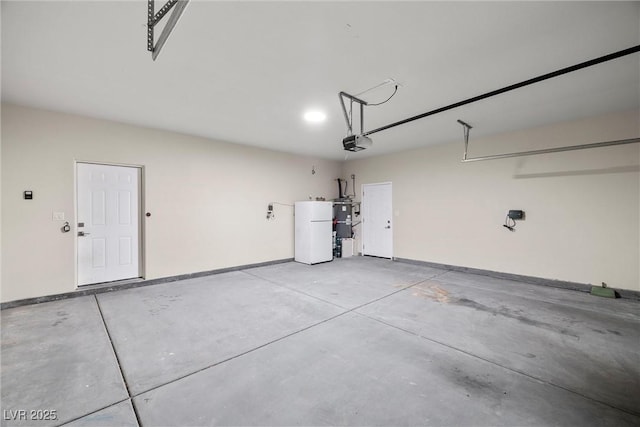 2120 Upland Ave, Pahrump, NV 89048 - garage featuring a garage door opener, secured water heater, and water heater