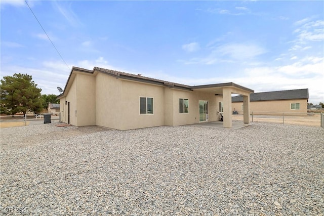 2120 Upland Ave, Pahrump, NV 89048 - rear view of house with stucco siding, a patio area, and a tile roof