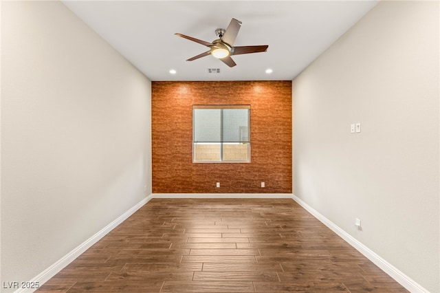 2116 Canvas Edge Dr, Henderson, NV 89044 - spare room with a ceiling fan, wood finished floors, recessed lighting, and an accent wall