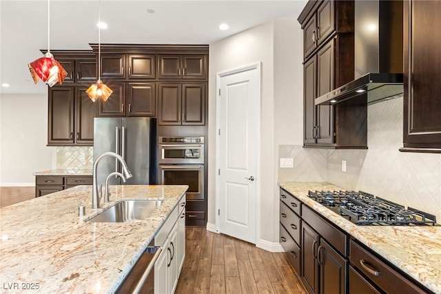 2116 Canvas Edge Dr, Henderson, NV 89044 - kitchen featuring wall chimney range hood, appliances with stainless steel finishes, dark brown cabinetry, and recessed lighting