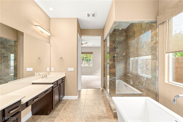 2116 Canvas Edge Dr, Henderson, NV 89044 - full bathroom with a freestanding tub, vanity, a shower stall, and tile patterned floors