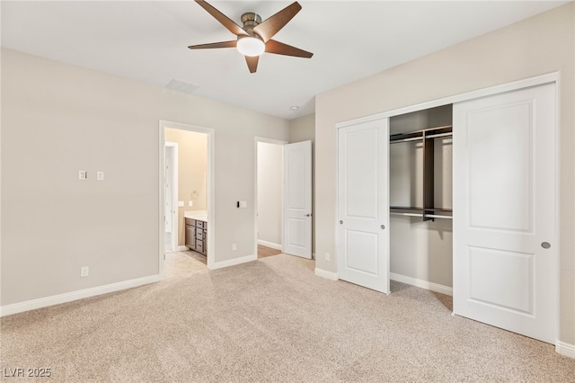 2116 Canvas Edge Dr, Henderson, NV 89044 - unfurnished bedroom with carpet flooring, a closet, a ceiling fan, and connected bathroom