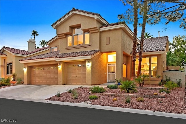 2021 Waterbury Ln, Las Vegas, NV 89134 - view of front of property with a tiled roof, concrete driveway, stucco siding, a chimney, and a garage