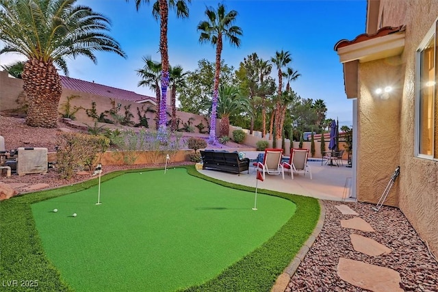 2021 Waterbury Ln, Las Vegas, NV 89134 - fenced backyard with a putting area and a patio