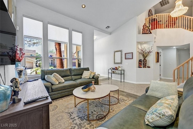 2021 Waterbury Ln, Las Vegas, NV 89134 - living area with high vaulted ceiling and stairway