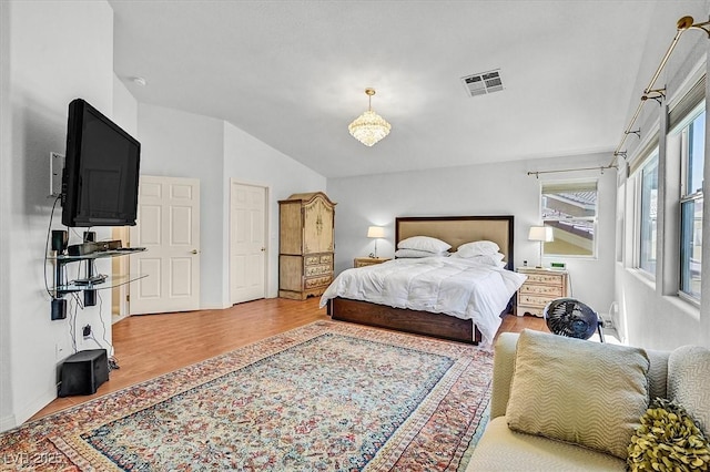 2021 Waterbury Ln, Las Vegas, NV 89134 - bedroom with lofted ceiling and wood finished floors