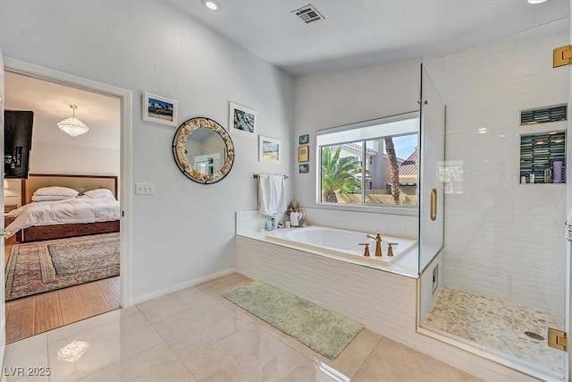 2021 Waterbury Ln, Las Vegas, NV 89134 - full bath with a garden tub, connected bathroom, a shower stall, tile patterned floors, and recessed lighting