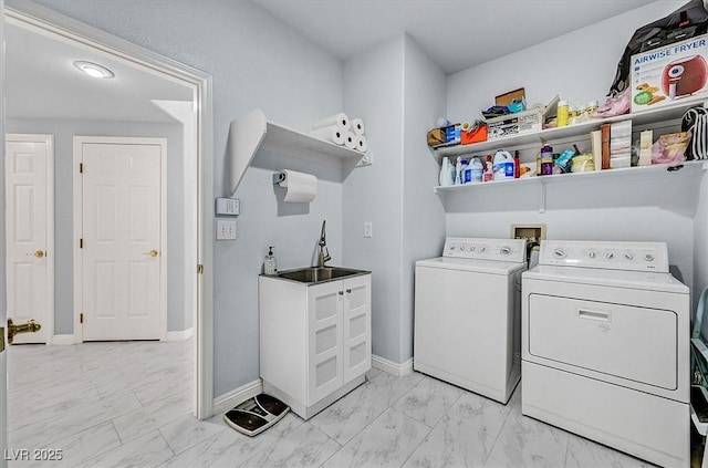 2021 Waterbury Ln, Las Vegas, NV 89134 - laundry room with independent washer and dryer and light marble finish floors
