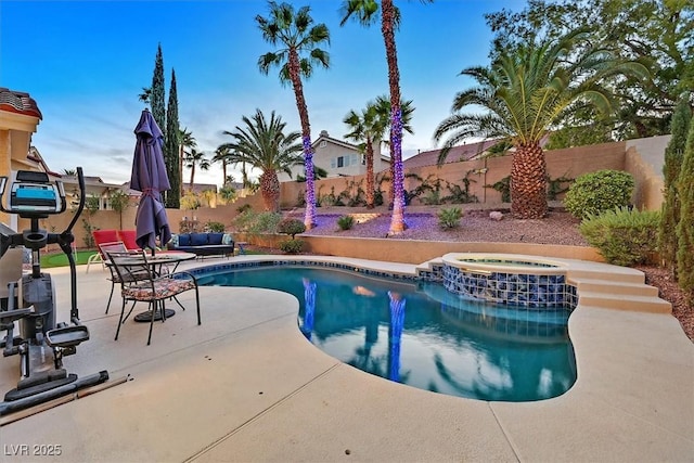 2021 Waterbury Ln, Las Vegas, NV 89134 - view of swimming pool with a fenced backyard, a patio area, a pool with connected hot tub, and an outdoor hangout area