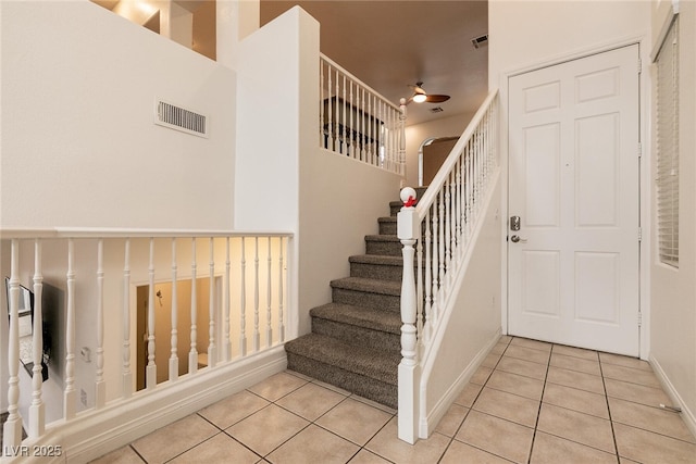 3412 Bearpin Gap Ln, Las Vegas, NV 89129 - stairs with tile patterned flooring and ceiling fan