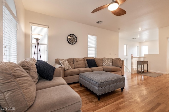 3412 Bearpin Gap Ln, Las Vegas, NV 89129 - living room featuring a ceiling fan and light wood-style floors