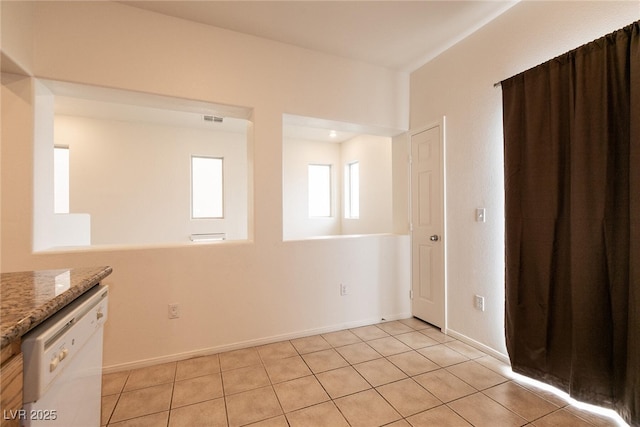 3412 Bearpin Gap Ln, Las Vegas, NV 89129 - unfurnished room featuring light tile patterned floors and baseboards