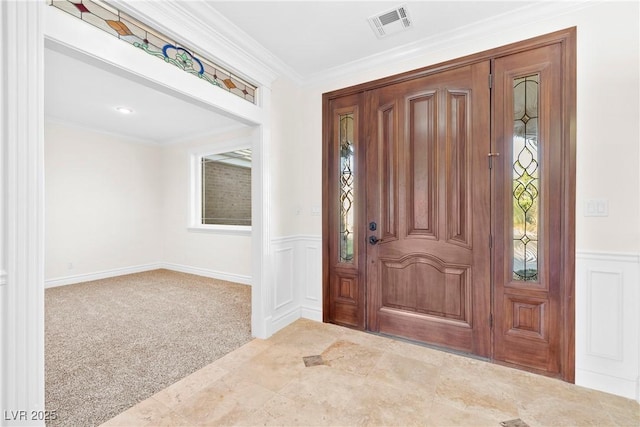 2477 Adobe Wells Dr, Logandale, NV 89021 - foyer with a wainscoted wall, crown molding, healthy amount of natural light, and a decorative wall