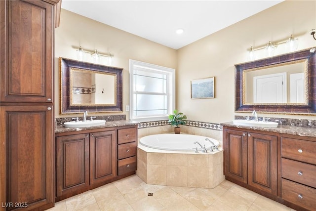 2477 Adobe Wells Dr, Logandale, NV 89021 - bathroom featuring two vanities, a bath, and tile patterned floors