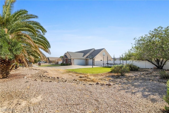 2477 Adobe Wells Dr, Logandale, NV 89021 - view of side of property featuring a garage and driveway