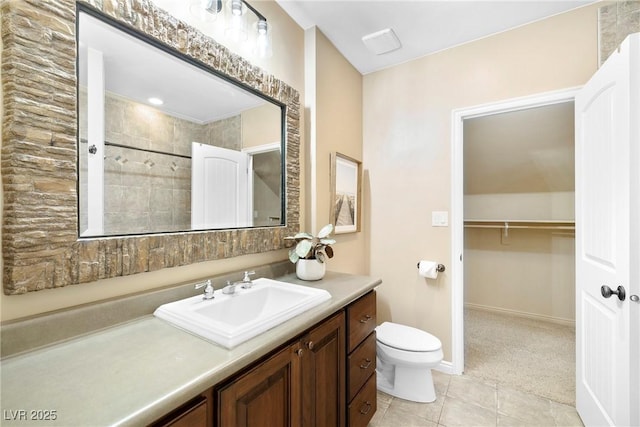 2477 Adobe Wells Dr, Logandale, NV 89021 - full bathroom with vanity, tile patterned flooring, and a spacious closet