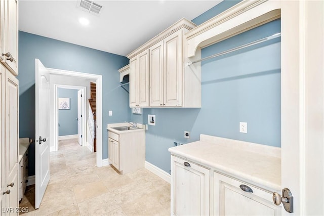 2477 Adobe Wells Dr, Logandale, NV 89021 - laundry room featuring cabinet space, washer hookup, and hookup for an electric dryer