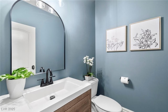 2477 Adobe Wells Dr, Logandale, NV 89021 - half bathroom featuring toilet and vanity