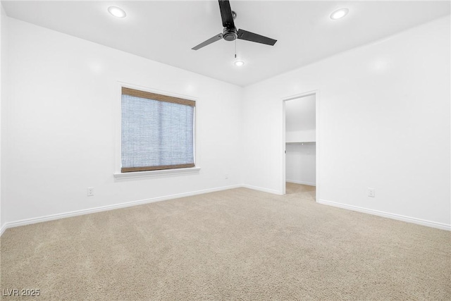 2477 Adobe Wells Dr, Logandale, NV 89021 - empty room with light carpet, ceiling fan, and recessed lighting