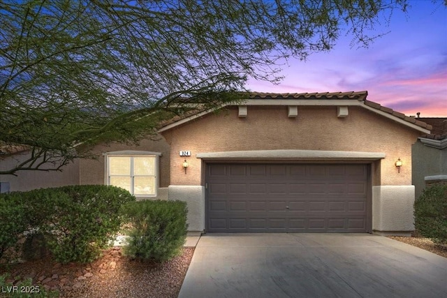 924 Crescent Falls St, Henderson, NV 89011 - mediterranean / spanish home featuring a garage, concrete driveway, and stucco siding