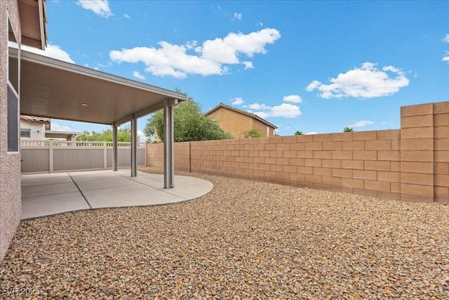 924 Crescent Falls St, Henderson, NV 89011 - fenced backyard with a patio