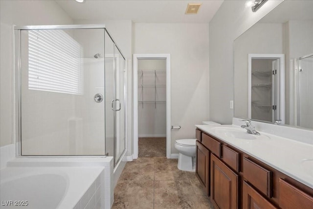924 Crescent Falls St, Henderson, NV 89011 - bathroom featuring a shower stall, a spacious closet, double vanity, and a garden tub