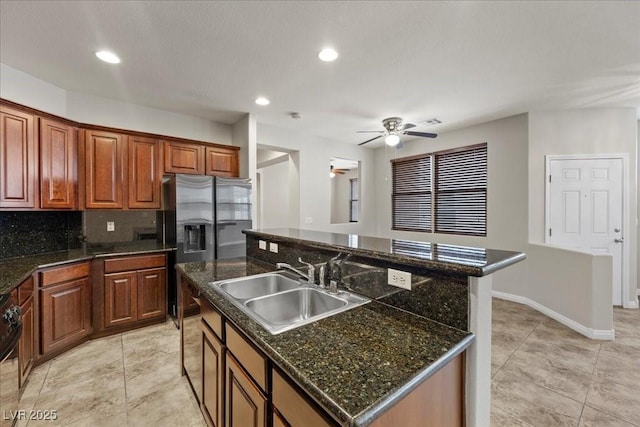 924 Crescent Falls St, Henderson, NV 89011 - kitchen featuring a kitchen island with sink, a ceiling fan, decorative backsplash, recessed lighting, and light tile patterned flooring