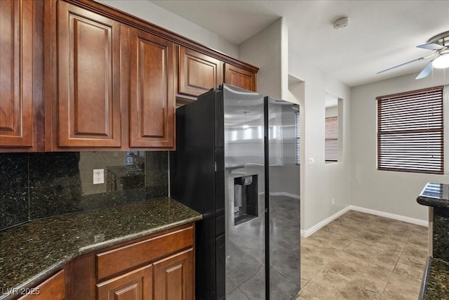 924 Crescent Falls St, Henderson, NV 89011 - kitchen featuring refrigerator with ice dispenser, ceiling fan, backsplash, dark stone counters, and brown cabinetry