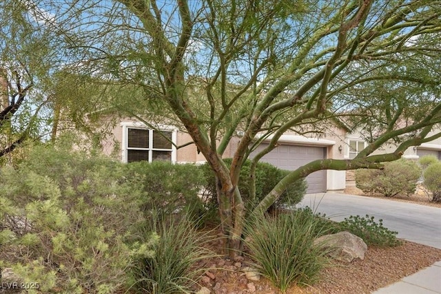 924 Crescent Falls St, Henderson, NV 89011 - view of front facade with concrete driveway, a garage, and stucco siding